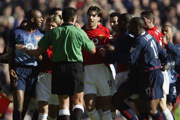 MANCHESTER - FEBRUARY 15:  Ruud van Nistelrooy of Manchester United argues with the referee Jeff Winter as a brawl breaks out during the FA Cup fifth round match between Manchester United and Arsenal held on February 15, 2003 at Old Trafford, in Manchester, England. Arsenal won the match 2-0. (Photo by Gary M. Prior/Getty Images)
