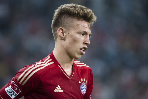 GUANGZHOU, GUANGDONG - JULY 26:  Mitchell Weiser of Bayern Munich in action during a friendly match against VfL Wolfsburg as part of the Audi Football Summit 2012 on July 26, 2012 at the Guangdong Olympic Sports Center in Guangzhou, China.  (Photo by Victor Fraile/Getty Images)