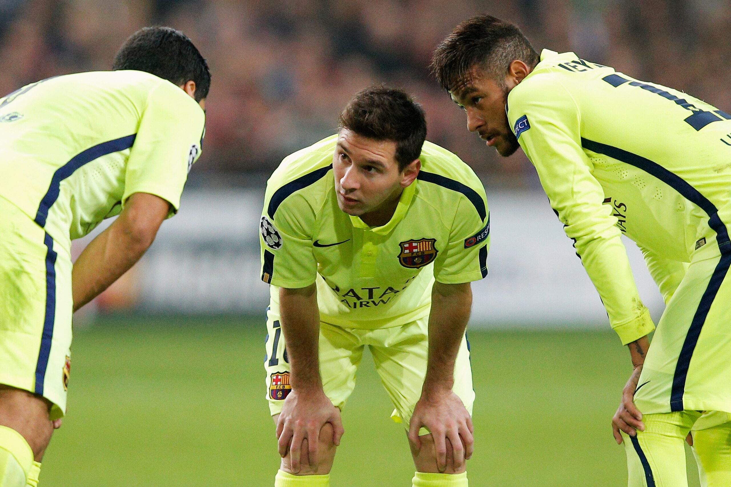 AMSTERDAM, NETHERLANDS - NOVEMBER 05: (L-R) Luis Suarez, Lionel Messi and Neymar of Barcelona discuss a free kick during the UEFA Champions League Group F match between AFC Ajax and FC Barcelona at The Amsterdam Arena on November 5, 2014 in Amsterdam, Netherlands. (Photo by Dean Mouhtaropoulos/Getty Images)