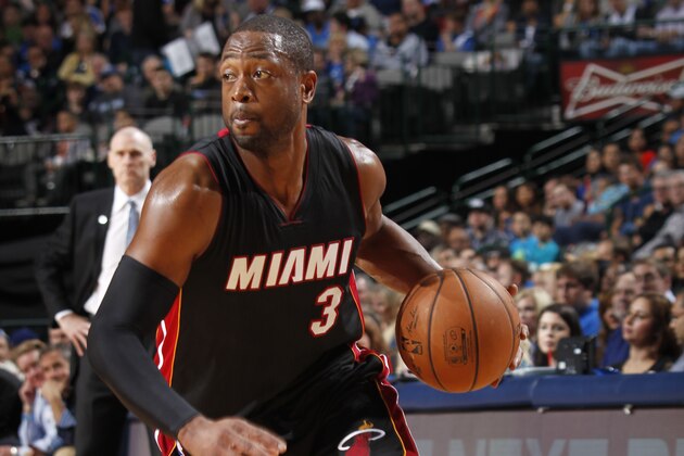 DALLAS, TX - NOVEMBER 9: Dwyane Wade #3 of the Miami Heat handles the ball against the Dallas Mavericks on November 9, 2014 at the American Airlines Center in Dallas, Texas. NOTE TO USER: User expressly acknowledges and agrees that, by downloading and or using this photograph, User is consenting to the terms and conditions of the Getty Images License Agreement. Mandatory Copyright Notice: Copyright 2014 NBAE (Photo by Glenn James/NBAE via Getty Images)