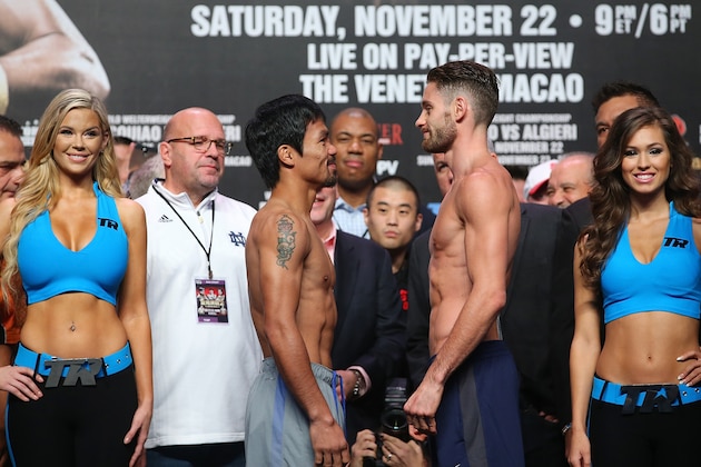 MACAU - NOVEMBER 22:  Manny Pacquiao and Chris Algieri face off during the official weigh in at The Venetianon on November 22, 2014 in Macau, Macau.  (Photo by Chris Hyde/Getty Images)