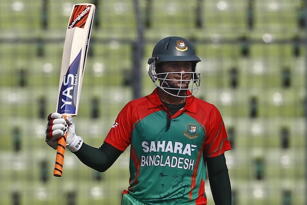 Bangladesh's Shakib Al Hasan acknowledges the crowd after scoring fifty runs during their first one-day International cricket match against India in Dhaka, Bangladesh, Sunday, June 15, 2014. (AP Photo/A.M. Ahad)