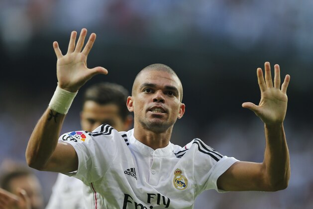 Real Madrid's Pepe celebrates after scoring during a Spanish La Liga soccer match between Real Madrid and Barcelona at the Santiago Bernabeu stadium in Madrid, Spain, Saturday Oct. 25, 2014. (AP Photo/Paul White)