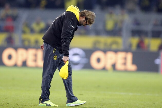 Dortmund's head coach Juergen Klopp bows to the tribune after his team won the German first division Bundesliga soccer match between BvB Borussia Dortmund and VfL Borussia Moenchengladbach in Dortmund, Germany, Sunday, Nov. 9, 2014. (AP Photo/Frank Augstein)