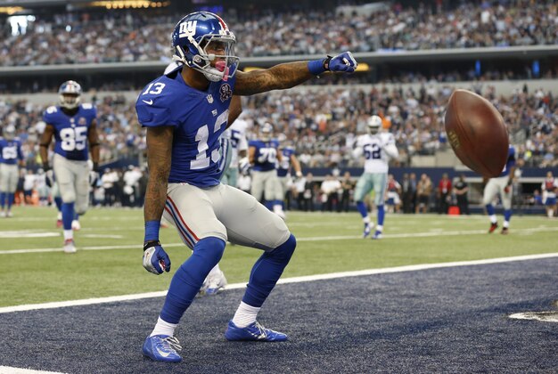 Oct 19, 2014; Arlington, TX, USA; New York Giants wide receiver Odell Beckham Jr. (13) celebrates his second quarter touchdown against the Dallas Cowboys at AT&T Stadium. Mandatory Credit: Matthew Emmons-USA TODAY Sports