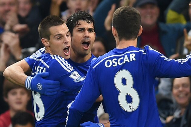 LONDON, ENGLAND - NOVEMBER 22:  Diego Costa of Chelsea celebrates scoring opening goal with team mates during the Barclays Premier League match between Chelsea and West Bromwich Albion at Stamford Bridge on November 22, 2014 in London, England.  (Photo by Tom Dulat/Getty Images)
