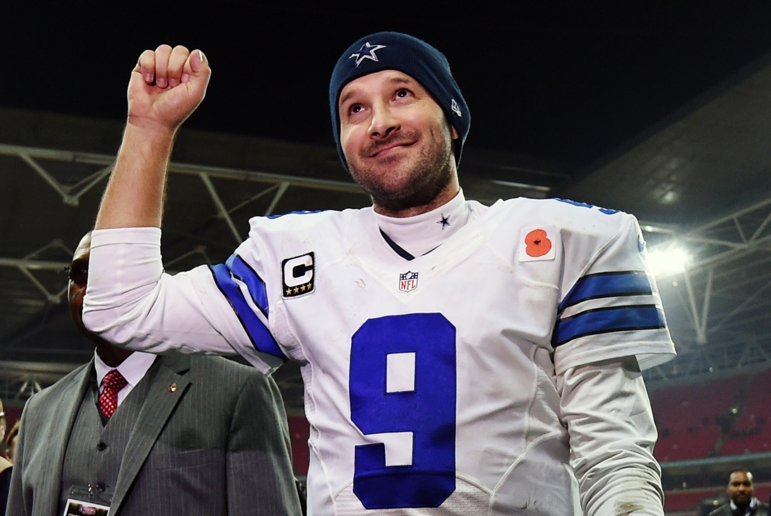 FILE - In this Nov. 9, 2014, file photo, Dallas Cowboys quarterback Tony Romo acknowledges spectators after the team's 31-17 victory over the Jacksonville Jaguars in an NFL football game at Wembley Stadium in London. Romo will play the New York Giants on Sunday night, Nov. 23, then figure out if his surgically repaired back can hold up for the quick Thanksgiving turnaround. (AP Photo/Tim Ireland, File)