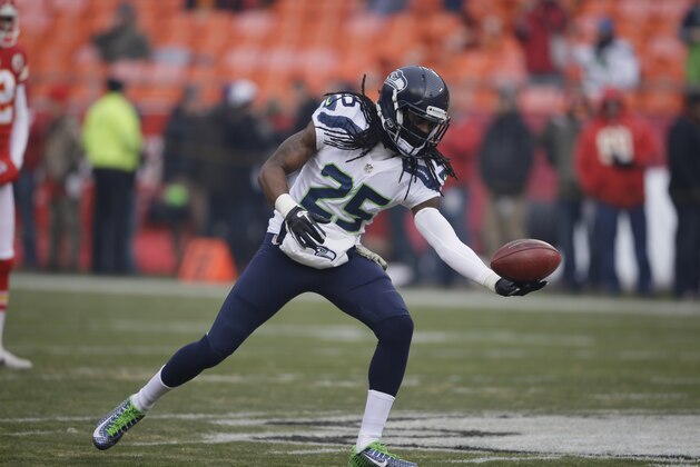 Seattle Seahawks cornerback Richard Sherman (25) makes a one-handed catch before an NFL football game against the Kansas City Chiefs in Kansas City, Mo., Sunday, Nov. 16, 2014. (AP Photo/Charlie Neibergall)