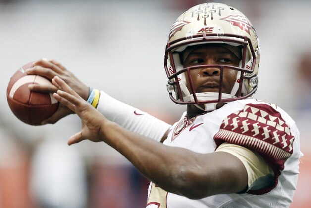 Florida State quarterback Jameis Winston (5) warms up before an NCAA college football game against Syracuse on Saturday, Oct. 11, 2014, in Syracuse, N.Y. (AP Photo/Mike Groll)