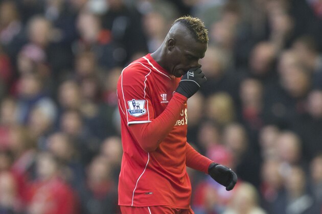 Liverpool's Mario Balotelli makes his way from the pitch after being substituted during his team's English Premier League soccer match between Liverpool and Chelsea at Anfield Stadium, Liverpool, England, Saturday Nov. 8, 2014. (AP Photo/Jon Super)