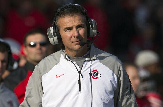 Nov 22, 2014; Columbus, OH, USA; Ohio State Buckeyes head coach Urban Meyer looks up at the scoreboard during the game against the Indiana Hoosiers at Ohio Stadium. Ohio State won the game 42-27. Mandatory Credit: Greg Bartram-USA TODAY Sports