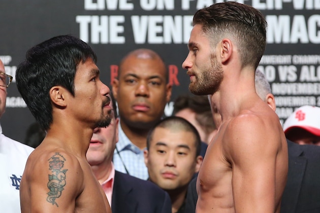 MACAU - NOVEMBER 22:  Manny Pacquiao and Chris Algieri face off during the official weigh in at The Venetianon on November 22, 2014 in Macau, Macau.  (Photo by Chris Hyde/Getty Images)