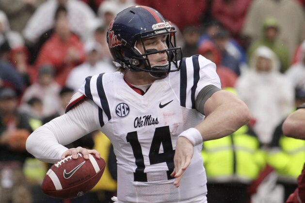 Mississippi quarterback Bo Wallace passes in the first quarter of an NCAA college football game against Arkansas Saturday, Nov. 22, 2014, in Fayetteville, Ark. (AP Photo/Danny Johnston)