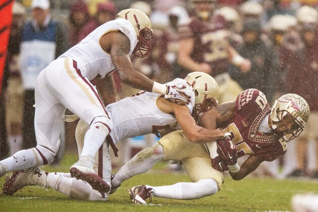 TALLAHASSEE, FL - NOVEMBER 22: Rashad Greene #80 of the Florida State Seminoles is taken down after a long pass against the Boston College Eagles during the first half at Doak Campbell Stadium on November 22, 2014 in Tallahassee, Florida. (Photo by Jeff Gammons/Getty Images)