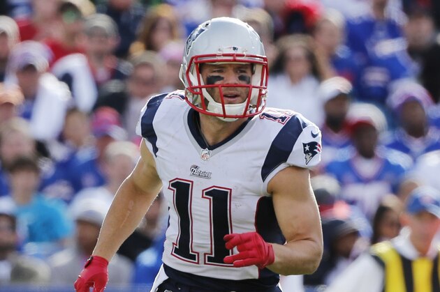 New England Patriots wide receiver Julian Edelman (11) runs on the field during the second half of an NFL football game against the Buffalo Bills on Sunday, Oct. 12, 2014, in Orchard Park, N.Y. (AP Photo/Mike Groll)