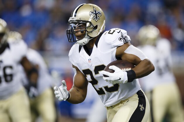 New Orleans Saints running back Pierre Thomas (23) rushes against the Detroit Lions during an NFL football game at Ford Field in Detroit, Sunday, Oct. 19, 2014. (AP Photo/Rick Osentoski)
