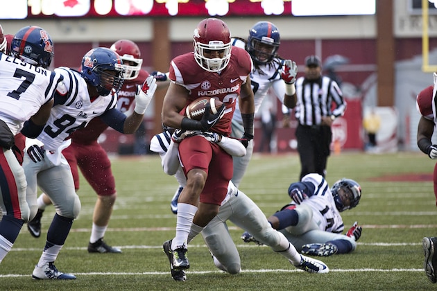 FAYETTEVILLE, AR - NOVEMBER 22:  Jonathan Williams #32 of the Arkansas Razorbacks runs the ball in the second quarter against the Ole Miss Rebels at Razorback Stadium on November 22, 2014 in Fayetteville, Arkansas.  (Photo by Wesley Hitt/Getty Images)
