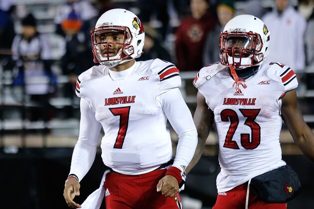 CHESTNUT HILL, MA - NOVEMBER 8: Reggie Bonnafon #7 of the Louisville Cardinals celebrates after a touchdown by Brandon Radcliff #23 in the fourth quarter against the  Boston College Eagles at Alumni Stadium on November 8, 2014 in Chestnut Hill, Massachusetts. (Photo by Jim Rogash/Getty Images)