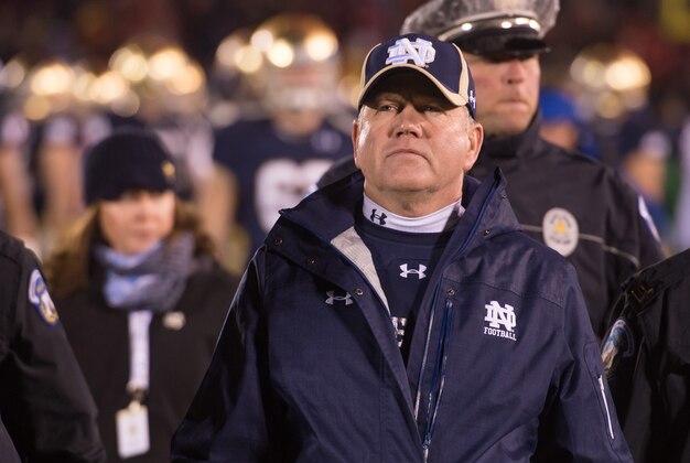 Nov 22, 2014; South Bend, IN, USA; Notre Dame Fighting Irish head coach Brian Kelly leaves the field after the Louisville Cardinals defeated Notre Dame 31-28 at Notre Dame Stadium. Mandatory Credit: Matt Cashore-USA TODAY Sports