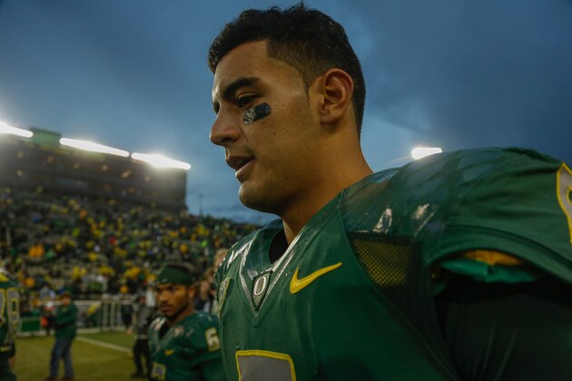 EUGENE, OR - NOVEMBER 22:  Quarterback Marcus Mariota #8 of the Oregon Ducks heads off the field after defeating the Colorado Buffaloes 44-10 at Autzen Stadium on November 22, 2014 in Eugene, Oregon.  (Photo by Otto Greule Jr/Getty Images)