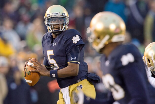 Nov 22, 2014; South Bend, IN, USA; Notre Dame Fighting Irish quarterback Everett Golson (5) looks to throw in the first quarter against the Louisville Cardinals at Notre Dame Stadium. Louisville won 31-28. Mandatory Credit: Matt Cashore-USA TODAY Sports