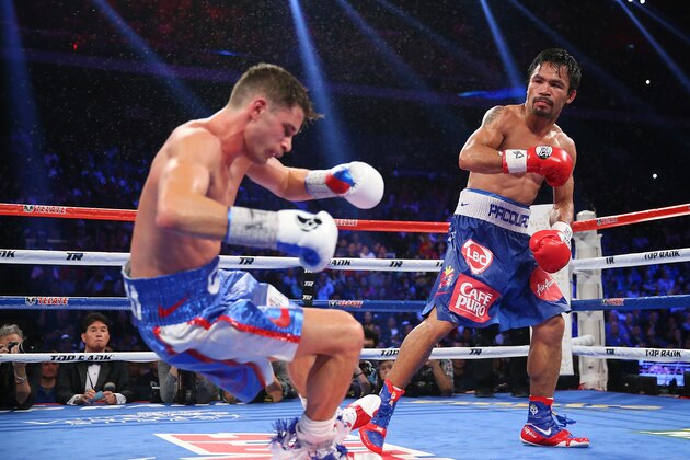 MACAU - NOVEMBER 23:  Manny Pacquiao of the Philippines knockes down Chris Algieri of the United States during the world welterweight title at The Venetian on November 23, 2014 in Macau, Macau.  (Photo by Chris Hyde/Getty Images)