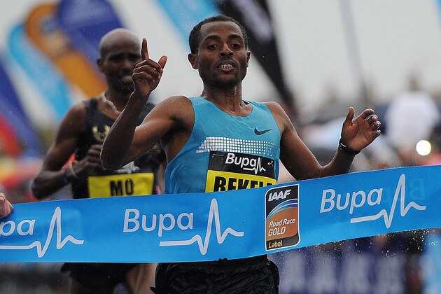 GATESHEAD, ENGLAND - SEPTEMBER 15: Kenenisa Bekele (R) of Ethiopia  reacts after winning the Great North Run on September 15, 2013 in Gateshead, England. (Photo by Nigel Roddis/Getty Images)