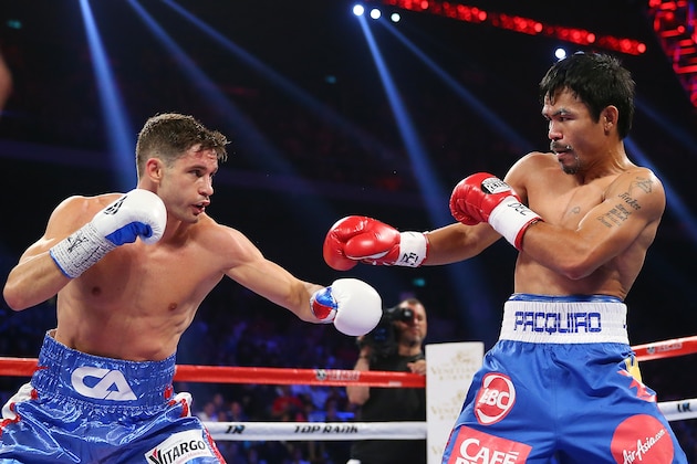 MACAU - NOVEMBER 23:  Chris Algieri of the United States punches Manny Pacquiao of the Philippines during the WBO world welterweight title at The Venetian on November 23, 2014 in Macau, Macau.  (Photo by Chris Hyde/Getty Images)