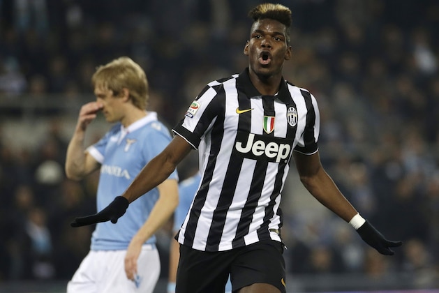 Juventus' Paul Pogba celebrates after scoring during the Serie A soccer match between Lazio and Juventus at Rome's Olympic Stadium, Saturday, Nov. 22, 2014. (AP Photo/Gregorio Borgia)