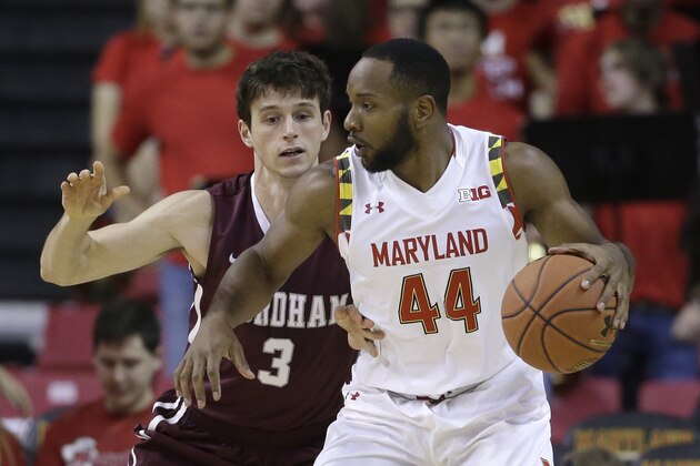 Maryland guard/forward Dez Wells, right, drives around Fordham guard Nemanja Zarkovic during an NCAA college basketball game, Thursday, Nov. 20, 2014, in College Park, Md. (AP Photo/Patrick Semansky)