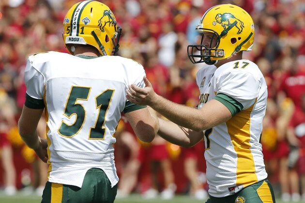 AMES, IA Ð AUGUST 30:  Place kicker Adam Keller #17 of the North Dakota State Bison celebrates with teammate long snapper James Fisher #51after kicking a field goal in the second half of play against the Iowa State Cyclones at Jack Trice Stadium on August 30, 2014 in Ames, Iowa. North Dakota State defeated Iowa State 34-14. (Photo by David Purdy/Getty Images)