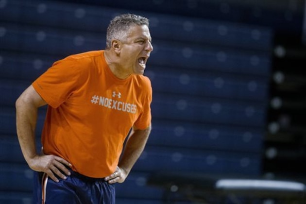 Auburn basketball coach Bruce Pearl shouts plays to his team during an NCAA college basketball practice Tuesday, Oct. 21, 2014, in Auburn, Ala. (AP Photo/Brynn Anderson)
