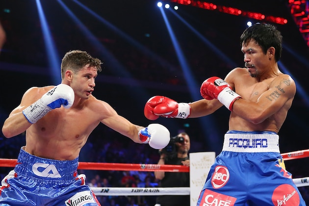 MACAU - NOVEMBER 23:  Chris Algieri of the United States punches Manny Pacquiao of the Philippines during the WBO world welterweight title at The Venetian on November 23, 2014 in Macau, Macau.  (Photo by Chris Hyde/Getty Images)