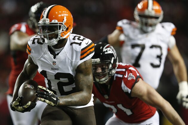 Cleveland Browns wide receiver Josh Gordon (12) moves against Atlanta Falcons outside linebacker Kroy Biermann (71) during the first half of an NFL football game, Sunday, Nov. 23, 2014, in Atlanta. (AP Photo/Brynn Anderson )