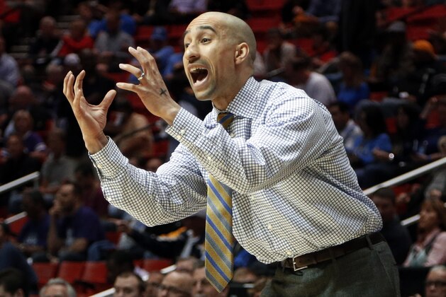Virginia Commonwealth head coach Shaka Smart gestures as his team plays Stephen F. Austin in the first half of a second-round game in the NCAA college basketball tournament Friday, March 21, 2014, in San Diego. (AP Photo/Lenny Ignelzi)
