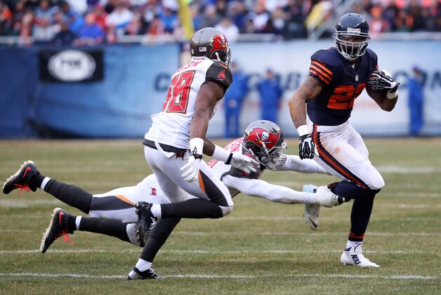 Nov 23, 2014; Chicago, IL, USA; Chicago Bears running back Matt Forte (22) is tackled by Tampa Bay Buccaneers defensive end Michael Johnson (90) during the game at Soldier Field. Mandatory Credit: Caylor Arnold-USA TODAY Sports