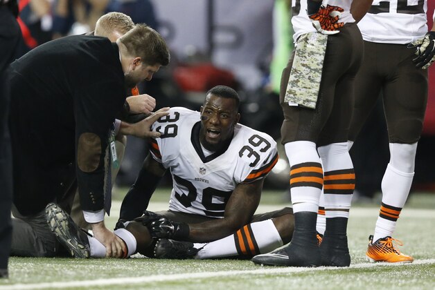 Cleveland Browns free safety Tashaun Gipson (39) is attended to by medical staff against the Atlanta Falcons during the second half of an NFL football game, Sunday, Nov. 23, 2014, in Atlanta.  (AP Photo/Brynn Anderson)