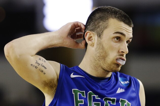 Florida Gulf Coast's Brett Comer (0) reacts during the second half of a regional semifinal game against Florida in the NCAA college basketball tournament, Friday, March 29, 2013, in Arlington, Texas. (AP Photo/David J. Phillip)