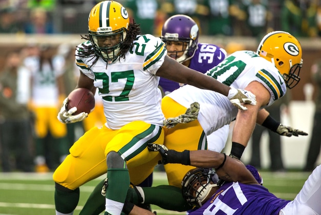 Nov 23, 2014; Minneapolis, MN, USA; Green Bay Packers running back Eddie Lacy (27) is tackled by Minnesota Vikings defensive end Everson Griffen (97) during the first quarter at TCF Bank Stadium. Mandatory Credit: Brace Hemmelgarn-USA TODAY Sports