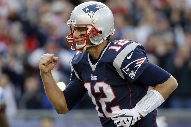 New England Patriots quarterback Tom Brady celebrates his second touchdown pass to Timothy Wright in the first half of an NFL football game against the Detroit Lions, Sunday, Nov. 23, 2014, in Foxborough, Mass. (AP Photo/Steven Senne)