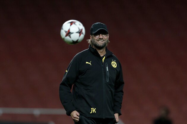 Borussia Dortmund's manager Jurgen Klopp supervises a training session at Arsenal's Emirates Stadium in London, England, Monday, Oct. 21, 2013. Arsenal are due to play Borussia Dortmund in a Champions League Group F soccer match in London on Tuesday. (AP Photo/Matt Dunham)