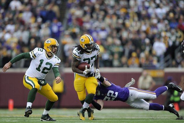 MINNEAPOLIS, MN - NOVEMBER 23: Harrison Smith #22 of the Minnesota Vikings tackles Eddie Lacy #27 of the Green Bay Packers as Aaron Rodgers #12 looks to set a block during the third quarter of the game on November 23, 2014 at TCF Bank Stadium in Minneapolis, Minnesota. The Packers defeated the Vikings 24-21. (Photo by Hannah Foslien/Getty Images)