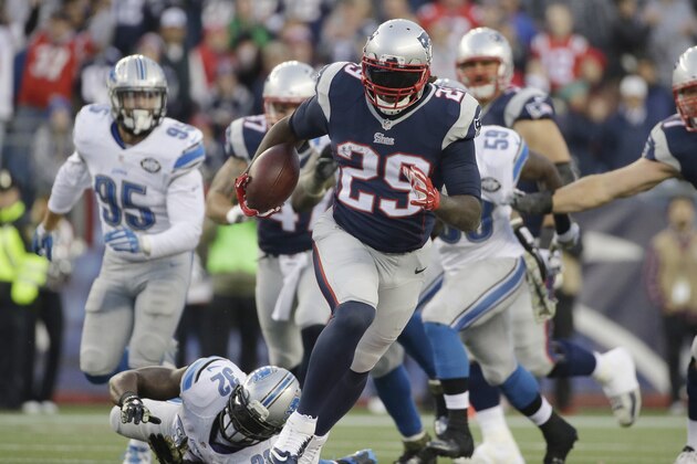 New England Patriots running back LeGarrette Blount (29) runs from Detroit Lions strong safety James Ihedigbo (32) in the second half of an NFL football game Sunday, Nov. 23, 2014, in Foxborough, Mass. (AP Photo/Steven Senne)