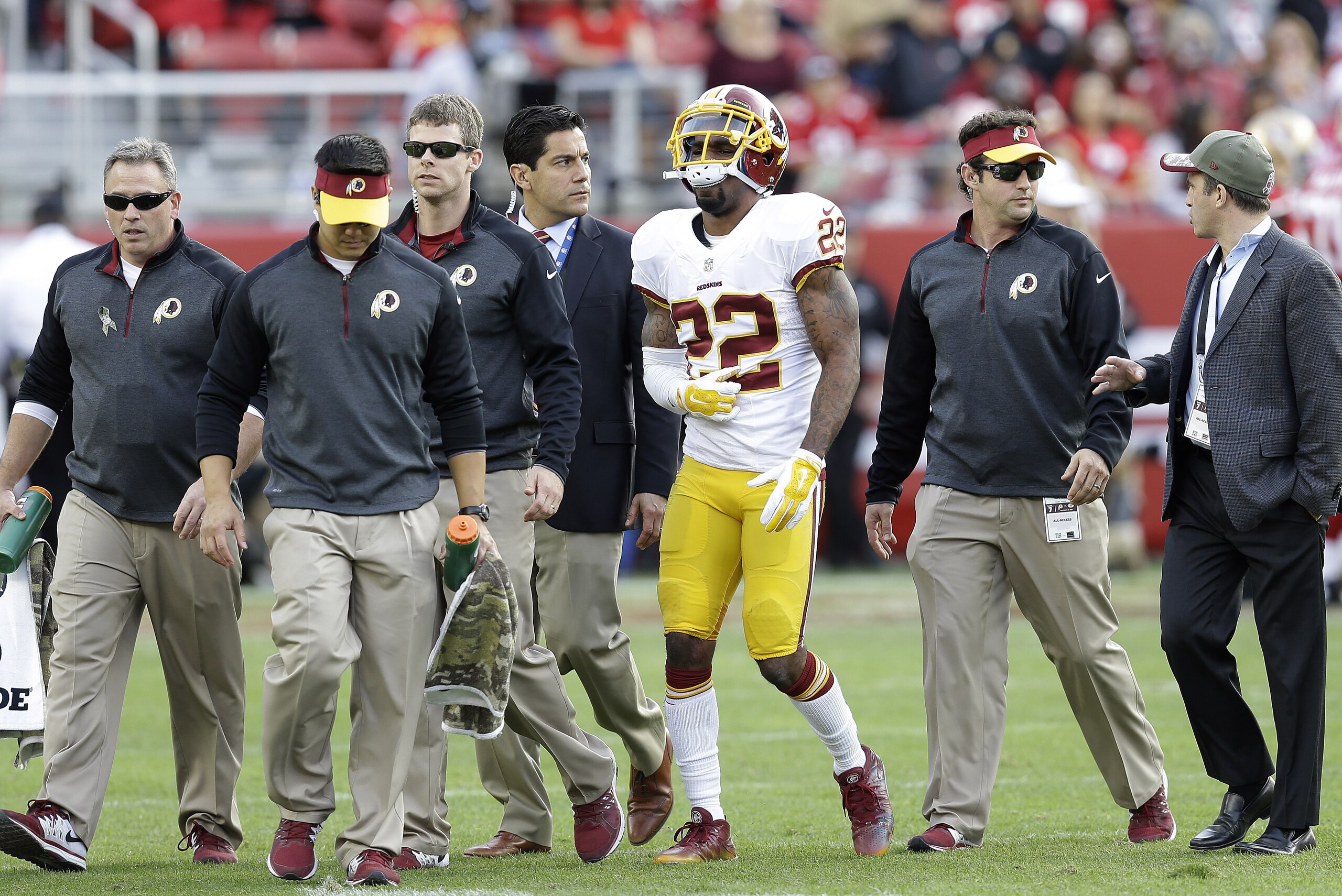 Washington Redskins cornerback Tracy Porter (22) walks off the field after being injured during the third quarter of an NFL football game against the San Francisco 49ers in Santa Clara, Calif., Sunday, Nov. 23, 2014. (AP Photo/Ben Margot)