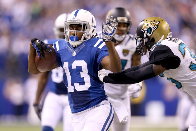 INDIANAPOLIS, IN - NOVEMBER 23:  T.Y. Hilton #13 of the Indianapolis Colts runs with the ball during the game against the Jacksonville Jaguars at Lucas Oil Stadium on November 23, 2014 in Indianapolis, Indiana.  (Photo by Andy Lyons/Getty Images)