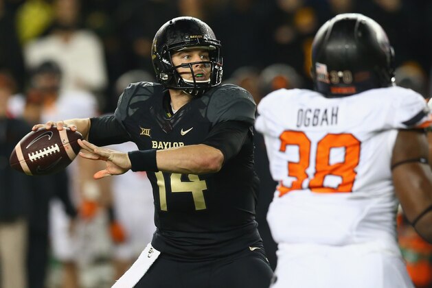 WACO, TX - NOVEMBER 22:  Bryce Petty #14 of the Baylor Bears throws against the Oklahoma State Cowboys at McLane Stadium on November 22, 2014 in Waco, Texas.  (Photo by Ronald Martinez/Getty Images)