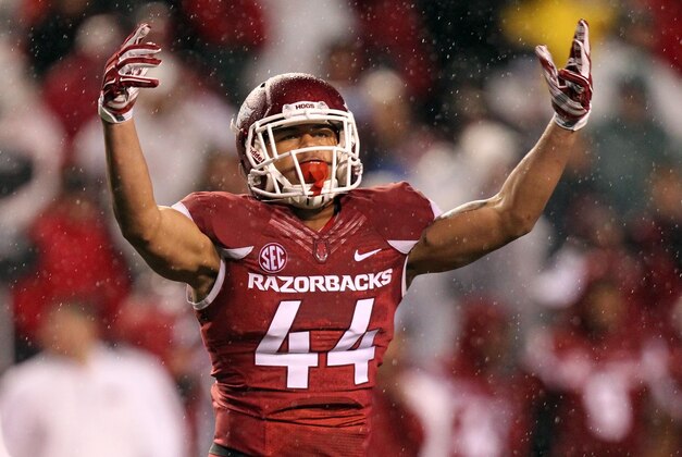 Nov 22, 2014; Fayetteville, AR, USA; Arkansas Razorbacks linebacker Khalia Hackett (44) motions to the fans during the game against the Ole Miss Rebels at Donald W. Reynolds Razorback Stadium. Arkansas defeated Mississippi 30-0. Mandatory Credit: Nelson Chenault-USA TODAY Sports