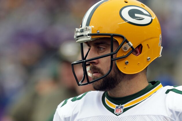 Green Bay Packers quarterback Aaron Rodgers stands on the sidelines during the second half of an NFL football game against the Minnesota Vikings, Sunday, Nov. 23, 2014, in Minneapolis. (AP Photo/Jim Mone)