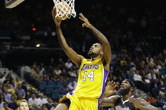 Los Angeles Lakers guard Roscoe Smith goes up for a shot against the Sacramento Kings during their NBA preseason basketball game Friday, Oct. 24, 2014, in Las Vegas. The Kings won 93-92. (AP Photo/John Locher)