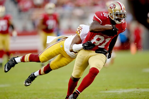 SANTA CLARA, CA - NOVEMBER 23:  Anquan Boldin #81 of the San Francisco 49ers gets tackled from behind by Bashaud Breeland #26 of the Washington Redskins late in the fourth quarter at Levi's Stadium on November 23, 2014 in Santa Clara, California.  (Photo by Thearon W. Henderson/Getty Images)